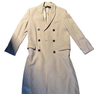 Beige long coat with black buttons